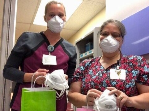 Members of the tuba city regional health care staff with N-95 masks donated from Honeywell.